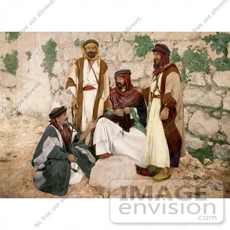 #20437 Historical Stock Photography of a Group of Male Bedouins Resting by a Wall, Holy Land by JVPD
