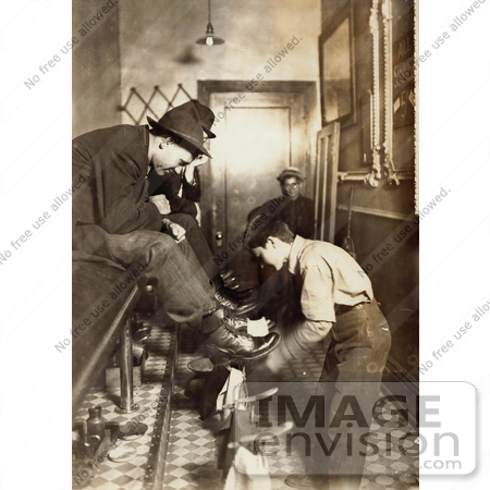 #20515 Historic Stock Photography of 15 Year Old Boy Shining a Man’s Shoes in a Shoeshining Parlor, 1908 by JVPD