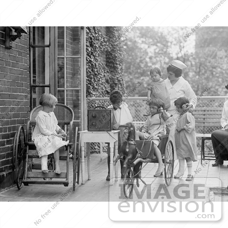 #20793 Stock Photography of a Nurse and Children Listening to a Radio by JVPD