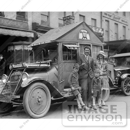 #20910 Stock Photography of a Family Standing by a Car That Resembles a House by JVPD