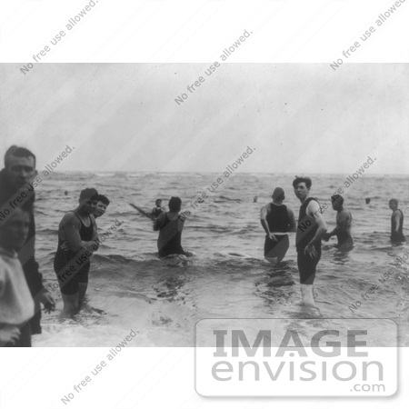 #21088 Stock Photography of a Group of Men Wading in Waist Deep Water and Playing Baseball in the Water by JVPD