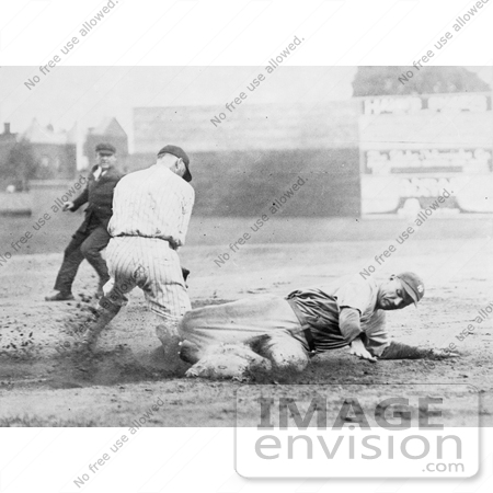 #21122 Stock Photography of Baseball Umpire Watching a Runner Sliding to Base Before Being Tagged by JVPD