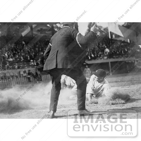 #21137 Stock Photography of an Umpire Watching as a Baseball Player Slides for Home Plate by JVPD
