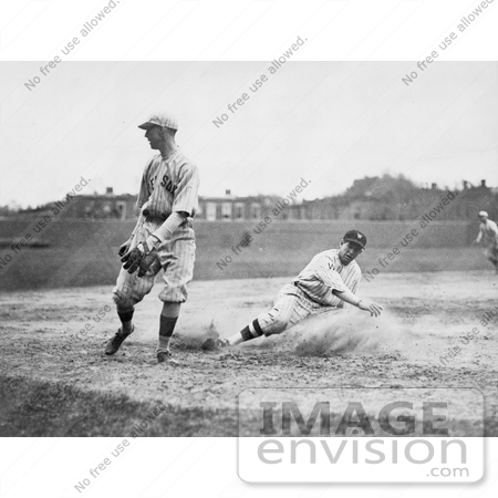 #21149 Stock Photography of a Baseball Player Sliding For Third Base as a Fielder Waits For the Ball by JVPD