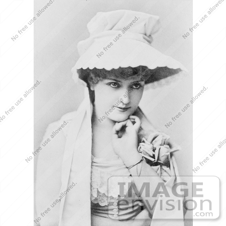 #21189 Stock Photography of Lillian Russell Wearing a Hat and Holding Her Hand Flirtatiously by JVPD