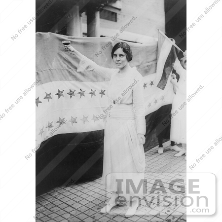 #21209 Stock Photography of Alice Paul Standing in Front of a Banner With Stars, Holding up a Glass by JVPD