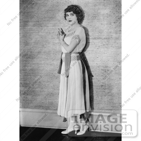 #21339 Stock Photography of Mary Pickford Looking Back Over Her Shoulder and Holding Her Hands as if They Were a Gun by JVPD