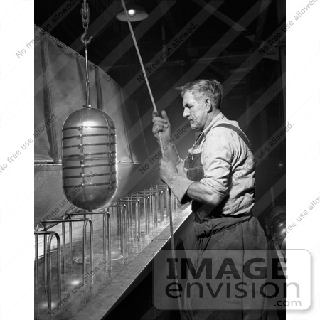 #21432 Historical Stock Photography of a Male Worker Sterilizing Beverage Containers, 1942 by JVPD