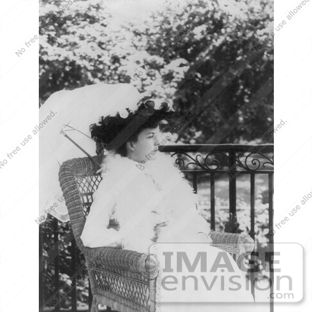 #21446 Stock Photography of Alice Roosevelt Longworth Outdoors, Sitting in a Wicker Chair Under a Parasol by JVPD