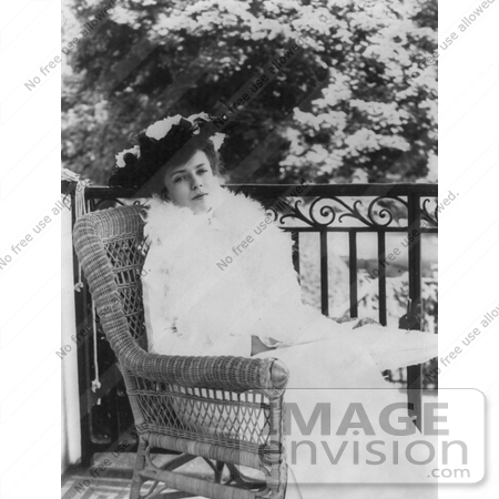 #21460 Stock Photography of Alice Roosevelt Longworth Sitting in a Wicker Chair Outside by JVPD