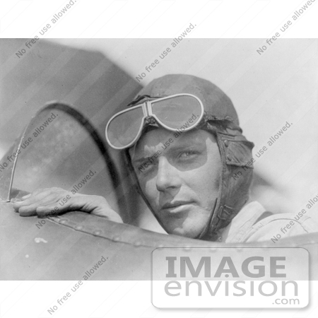 #21639 Stock Photography of Charles Lindbergh in a Helmet and Goggles, Sitting in a Plane Cockpit by JVPD