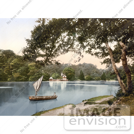 #21842 Historical Stock Photography of a Man in a Sailboat on the Dart River Near the Sharpham Vineyard Estate in Darmouth Devon England by JVPD