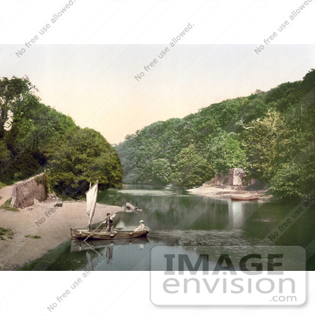 #21858 Historical Stock Photography of a Man Rowing a Boat Ashore on the Old Mill Creek Dartmouth Devon England by JVPD