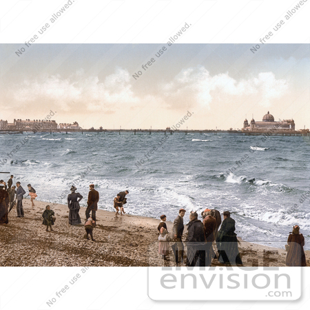 #21948 Stock Photography of People on the Beach Playing in the Surf Near the Pier in Morecambe Lancashire England UK by JVPD