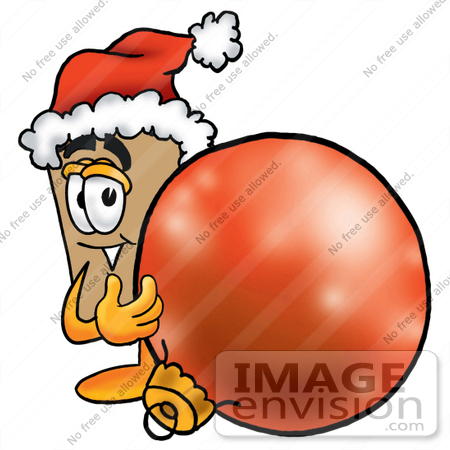 #22975 Clip Art Graphic of a Cardboard Shipping Box Cartoon Character Wearing a Santa Hat, Standing With a Christmas Bauble by toons4biz