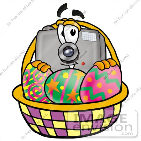 #23146 Clip Art Graphic of a Flash Camera Cartoon Character in an Easter Basket Full of Decorated Easter Eggs by toons4biz