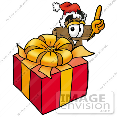 #23516 Clip Art Graphic of a Wooden Cross Cartoon Character Standing by a Christmas Present by toons4biz