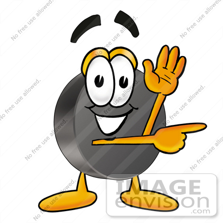 #24133 Clip Art Graphic of an Ice Hockey Puck Cartoon Character Waving and Pointing by toons4biz