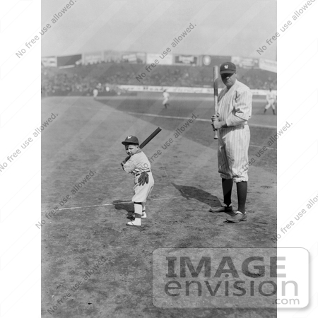 #25306 Sports Stock Photography of Babe Ruth and a Boy, Little Mascot, Posing With Bats on a Baseball Field by JVPD