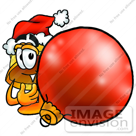 #25759 Clip Art Graphic of a Yellow Safety Hardhat Cartoon Character Wearing a Santa Hat, Standing With a Christmas Bauble by toons4biz