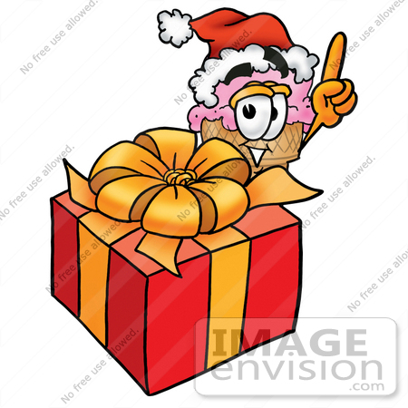 #25811 Clip Art Graphic of a Strawberry Ice Cream Cone Cartoon Character Standing by a Christmas Present by toons4biz
