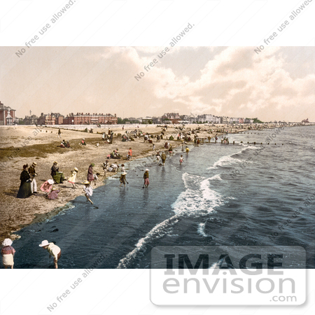 #26789 Stock Photography of Women Watching Over Children Playing In The Surf On The Beach At Littlehampton Arun West Sussex England UK by JVPD