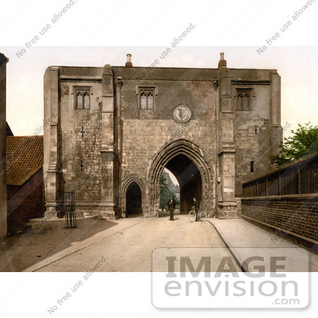 #26875 Stock Photography of Two Men With a Bicycle in front of the Bayle Gate in Bridlington Yorkshire England UK by JVPD