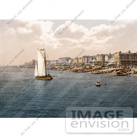 #26878 Stock Photography of a Sailboat by Bathing Machines and People on the Beach in Worthing West Sussex England UK by JVPD