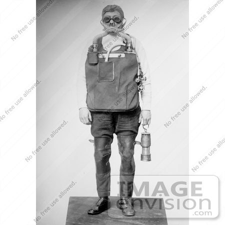 #27640 Stock Photo of a Male Mine Rescuer In A Mask And Safety Gear, Carrying A Lantern by JVPD