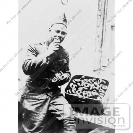 #27888 Historical Stock Photo of a Male American Soldier Seated And Eating From A Big Box Of Donuts by JVPD
