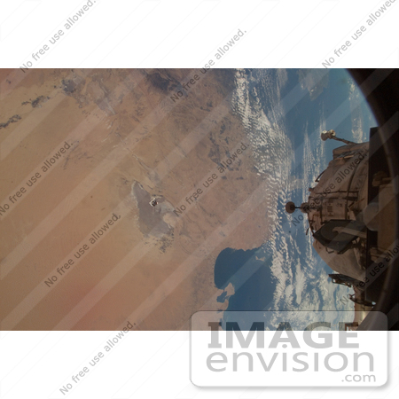 #30723 Stock Photo Of An Unpiloted Progress Supply Vehicle On Its Way To Dock With The International Space Station Backdropped By A Chott Djerid Salt Marsh In Tunisia On February 7th 2008 by JVPD