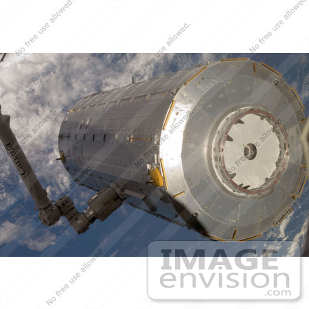 #30725 Stock Photo Of The Kibo Japanese Pressurized Module Being Moved From Stowage To The Port Side Of The Harmony Node Of The International Space Station In The Grasp Of The Station’s Robotic Canadarm2 On June 3rd 2008 by JVPD