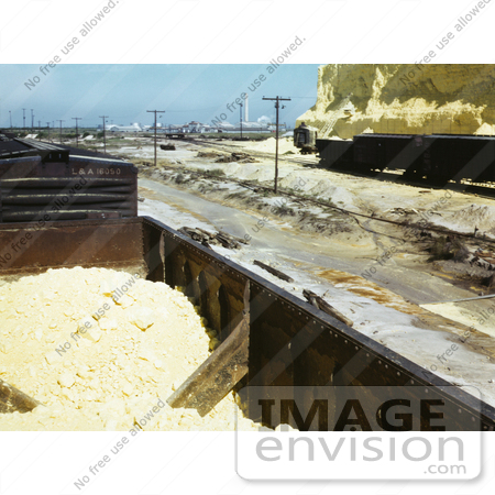 #30944 Stock Photo of a Closeup Of A Box Car Loaded With Sulphur Near A Tall Vat At The Freeport Sulphur Company In Hoskins Mound, Texas by JVPD
