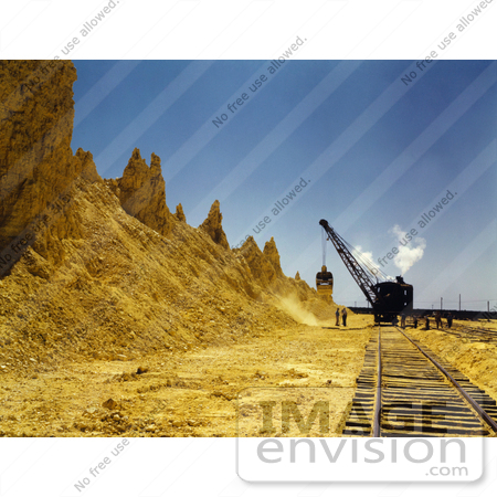 #30945 Stock Photo of a Dragline Excavator On The Railroad Tracks, Loading Boxcars Full Of Sulphur At A Vat At The Freeport Sulphur Company In Hoskins Mound, Texas by JVPD