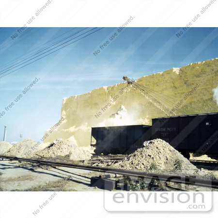 #30946 Stock Photo of an Excavator Loading Railroad Cars With Scoops Of Sulphur From A Vat At The Freeport Sulphur Company In Hoskins Mound, Texas by JVPD