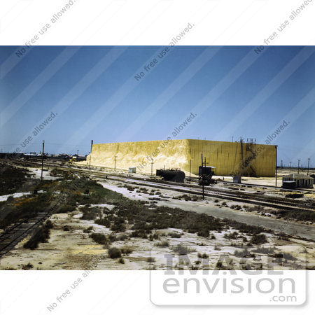 #30948 Stock Photo of Railroad Box Cars Lined Up For Loading By A 60 Foot High Sulphur Vat At The Freeport Sulphur Company In Hoskins Mound, Texas by JVPD