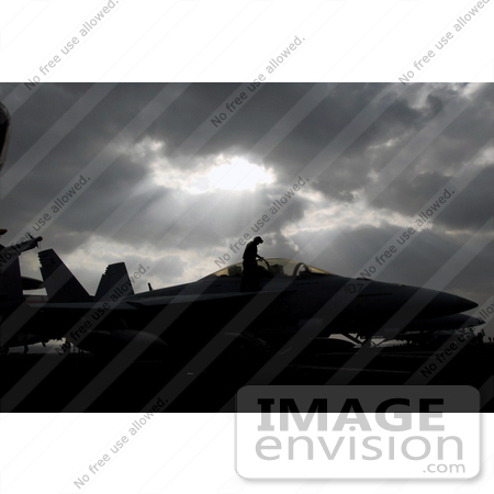 #35241 Stock Photo of a U.S. Navy Sailors Cleaning An F/A-18 Hornet Aircraft On The Flight Deck Aboard The Nuclear-Powered Aircraft Carrier Uss Nimitz by JVPD