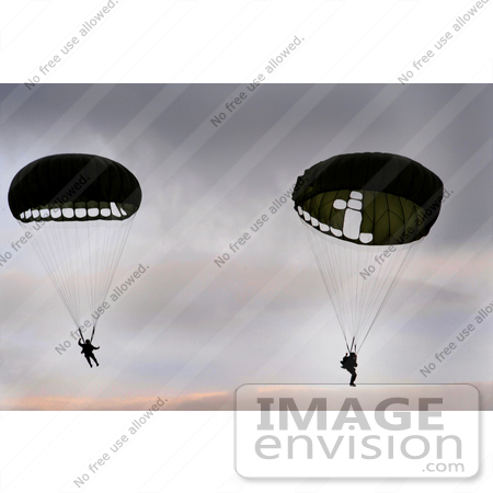 #35252 Stock Photo of U.S. Airmen From The 786th Security Forces Squadron Parachuting And Floating To The Ground by JVPD