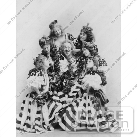 #35672 Stock Photo Of A Man, Actor De Wolf Hopper, Surrounded By A Group Of Beautiful Ladies In Dresses, Performing During The Broadway Musical, El Capitan, 1896 by JVPD