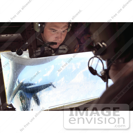 #36189 Stock Photo of an Airman Refueling an F-16 Fighting Falcon by JVPD