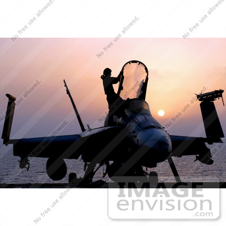 #36191 Stock Photo of a Silhouetted F/A-18C Hornet and Person at Sunset by JVPD