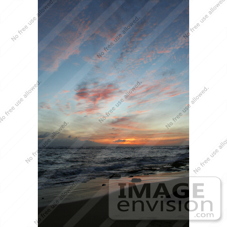 #36506 Stock Photo of Pink Clouds Scattered In A Blue Sky Above A Deep Orange Sunset Over The Ocean, From Poipu, Kauai, Hawaii by Jamie Voetsch
