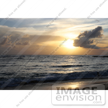 #36507 Stock Photo of a Sailboat In The Distance On The Ocean At Sunset, Seen From Poipu, Kauai, Hawaii by Jamie Voetsch