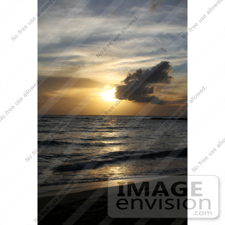 #36510 Stock Photo of a Sailboat Far In The Distance On The Ocean At Sunset, Seen From Poipu, Kauai, Hawaii by Jamie Voetsch