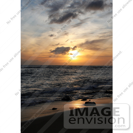 #36514 Stock Photo of an Orange Sunset With Scattered Clouds Over The Ocean With Light Reflecting On The Wet Sand And Surf, Poipu, Kauai, Hawaii by Jamie Voetsch