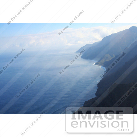 #36526 Stock Photo of The Na Pali Coastline With Rippling Blue Waters Of The Pacific Ocean by Jamie Voetsch