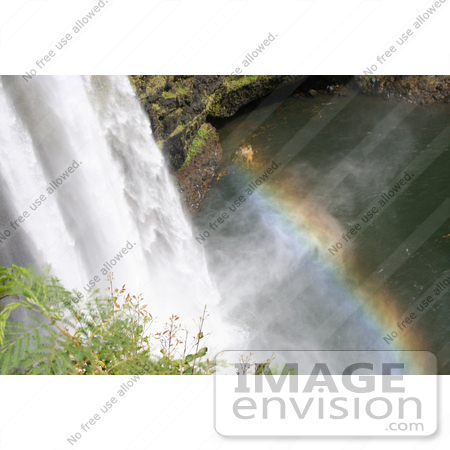 #36527 Stock Photo of a Rainbow In The Mist Above The Pool At The Bottom Of The Wailua Falls, Kauai, Hawaii by Jamie Voetsch