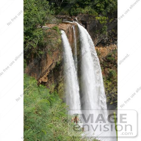 #36529 Stock Photo of Water Of The Wailua River Forming The Wailua Falls As It Flows Over The Red Cliffs, Kauai, Hawaii by Jamie Voetsch