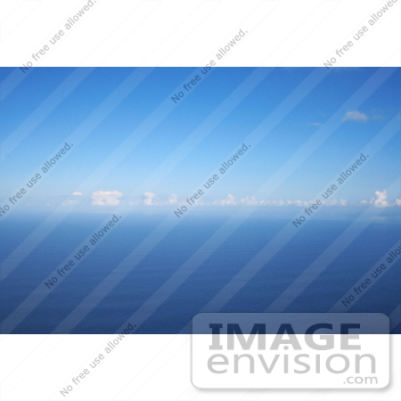 #36532 Stock Photo of a Seascape Of Blue Rippling Waters Of The Pacific Ocean With Puffy White Clouds And Blue Skies by Jamie Voetsch