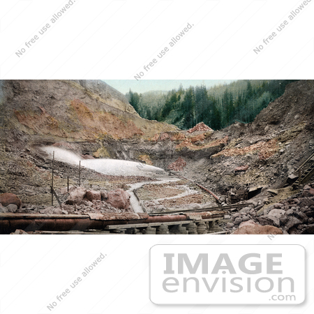 #40797 Stock Photo of Hydraulic Placer Mining Pipes Spraying Water, Against Stone, Colorado by JVPD